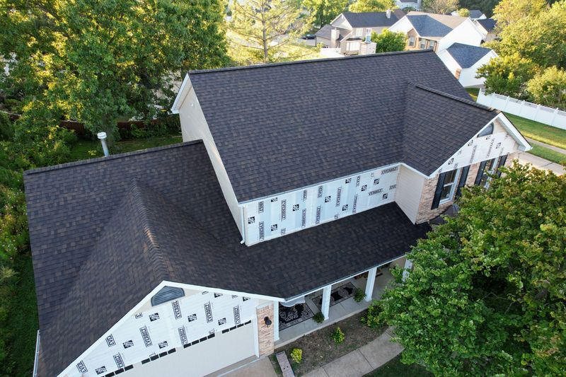 Aerial view of residential roof replacement in progress
